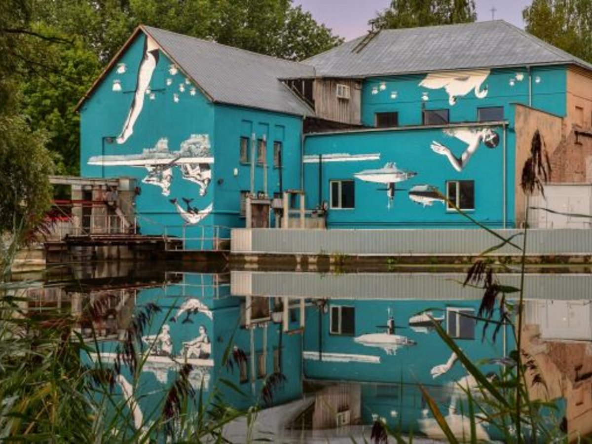 Marijampole. Wall Mural Unveiled in River Reflection